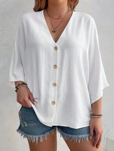 Signe – Blus med knäppning och ¾-ärm